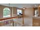 Spacious loft featuring natural lighting, a ceiling fan, and an adjacent room with desk space at 136 Elba Dr, Mooresville, NC 28115