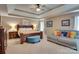 Spacious main bedroom with tray ceiling, sitting area, and a serene, inviting ambiance at 136 Elba Dr, Mooresville, NC 28115