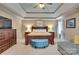 Comfortable main bedroom with tray ceiling, ample space, and soft, natural light at 136 Elba Dr, Mooresville, NC 28115