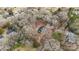 Aerial view of a home nestled amongst trees surrounded by neighborhood at 137 S Penny St, Lancaster, SC 29720