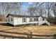 Charming home with white siding, black trim and a welcoming entrance staircase at 137 S Penny St, Lancaster, SC 29720