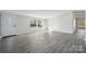 Bright, open living space with neutral walls and wood-look flooring at 137 S Penny St, Lancaster, SC 29720