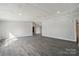 Bright living room with neutral walls and modern wood-look flooring at 137 S Penny St, Lancaster, SC 29720