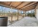 Spacious screened-in porch with wood floors and ceiling, perfect for outdoor relaxation at 137 S Penny St, Lancaster, SC 29720