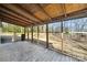 Covered porch with a wood ceiling overlooking a wooded lot, perfect for enjoying the outdoors at 137 S Penny St, Lancaster, SC 29720