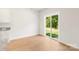 Bright dining area with wood floors and sliding glass doors to the outdoor greenery at 1544 Doran Ter, Richburg, SC 29729