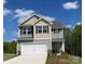 Charming two-story home featuring a mix of lap siding and a two car garage at 1544 Doran Ter, Richburg, SC 29729
