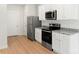 Stainless steel appliances and granite countertops in the kitchen at 1544 Doran Ter, Richburg, SC 29729
