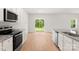 Open concept kitchen with access to the backyard and granite countertops at 1544 Doran Ter, Richburg, SC 29729