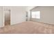 Spacious bedroom with plush carpeting, a large window, a walk-in closet, and an ensuite bathroom at 1546 Doran Ter, Richburg, SC 29729