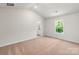 Bright bedroom features neutral tones, window, and carpeted floor at 1546 Doran Ter, Richburg, SC 29729