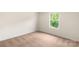 Bright bedroom featuring neutral walls, carpet, and a window with a leafy view at 1546 Doran Ter, Richburg, SC 29729