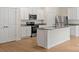 Well-equipped kitchen with white cabinets, granite countertops, and stainless steel appliances for modern convenience at 1546 Doran Ter, Richburg, SC 29729