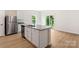 The kitchen island provides extra counter space and additional features of stainless steel appliances and plenty of natural light at 1546 Doran Ter, Richburg, SC 29729