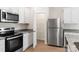 A functional kitchen with stainless steel appliances, granite countertops, and a large pantry for optimal organization at 1546 Doran Ter, Richburg, SC 29729