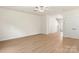 Spacious living room with neutral walls and wood-look floors, offering a blank canvas for personalization at 1546 Doran Ter, Richburg, SC 29729