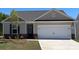 Charming single-story home featuring a two-car garage, stone accents, and neutral siding for a modern look at 1550 Doran Ter, Richburg, SC 29729