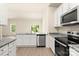 Open concept kitchen with stainless steel appliances, granite countertops, and white cabinets at 1550 Doran Ter, Richburg, SC 29729
