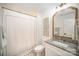 Bathroom featuring a granite countertop, framed mirror, and a shower with a stylish curtain at 16432 Here At Last Ln, Charlotte, NC 28278