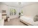 Bright bedroom with large windows, neutral tones, and stylish decor creates a serene and inviting space at 16432 Here At Last Ln, Charlotte, NC 28278