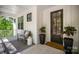 Inviting front porch featuring comfortable seating, a welcome mat, and a stylish black front door at 16432 Here At Last Ln, Charlotte, NC 28278