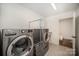 Laundry room includes modern appliances and ample space for storage, ensuring convenience and functionality at 16432 Here At Last Ln, Charlotte, NC 28278