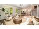 Open-concept living room flows to the kitchen, dining area and features hardwood flooring at 16432 Here At Last Ln, Charlotte, NC 28278
