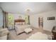Serene main bedroom with plush carpeting, a decorative chandelier, and a convenient walk-in closet at 16432 Here At Last Ln, Charlotte, NC 28278