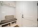 Charming mudroom with built-in bench, storage cubbies, and shelving providing a functional and organized space at 16432 Here At Last Ln, Charlotte, NC 28278