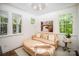 Bright sitting room with natural light, stylish furniture, and serene artwork at 16432 Here At Last Ln, Charlotte, NC 28278