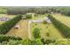 Expansive aerial view of a home, showcasing its large lawn, outbuildings, surrounding trees, and a long driveway at 1720 Lowe Dr, Catawba, NC 28609