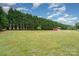 Large backyard with plenty of grass and a small storage shed at 1720 Lowe Dr, Catawba, NC 28609