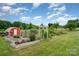 Beautiful garden with raised beds and a charming trellis, perfect for gardening enthusiasts at 1720 Lowe Dr, Catawba, NC 28609