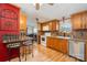 Charming kitchen features oak cabinets, laminate counters, and a breakfast bar at 1720 Lowe Dr, Catawba, NC 28609
