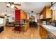 Eat-in kitchen featuring wood cabinets, laminate countertops and flooring, and barstool seating at 1720 Lowe Dr, Catawba, NC 28609