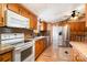 Bright kitchen with oak cabinets, laminate counters, and stainless steel refrigerator at 1720 Lowe Dr, Catawba, NC 28609