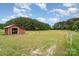Spacious lot featuring an outbuilding on a well-maintained green field, offering ample space at 1720 Lowe Dr, Catawba, NC 28609