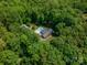Aerial view of a secluded home surrounded by dense trees, with in-ground pool at 174 Buena Vale Dr, Gastonia, NC 28056