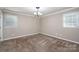 Neutral bedroom with carpet, window, and traditional light fixture at 174 Buena Vale Dr, Gastonia, NC 28056