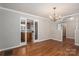 Dining room featuring hardwood floors and sliding glass doors to kitchen at 174 Buena Vale Dr, Gastonia, NC 28056