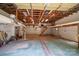 Spacious garage interior with high ceilings, exposed beams, and a loft area for storage at 174 Buena Vale Dr, Gastonia, NC 28056