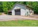 View of outbuilding featuring a large, metal garage door at 174 Buena Vale Dr, Gastonia, NC 28056