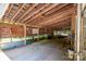 Interior view of an outbuilding with a wooden frame and a variety of equipment and storage at 174 Buena Vale Dr, Gastonia, NC 28056
