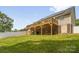 Large backyard features a spacious wooden deck, brick supports and lush green grass at 208 N Kayla Dr, Salisbury, NC 28146
