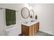 A bathroom features a double sink vanity, a large mirror, and a decorative patterned floor at 208 N Kayla Dr, Salisbury, NC 28146