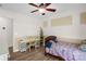 Bedroom with wood-look flooring, a ceiling fan, and a bright, sunny window at 208 N Kayla Dr, Salisbury, NC 28146
