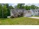 Charming single-Gathering home featuring a two-car garage, manicured lawn, and decorative dormers at 208 N Kayla Dr, Salisbury, NC 28146