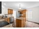 Well-lit kitchen features stainless steel appliances, wood cabinets, granite countertops and center island at 208 N Kayla Dr, Salisbury, NC 28146