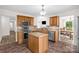 Well-equipped kitchen features oak cabinets, granite countertops, stainless appliances and center island at 208 N Kayla Dr, Salisbury, NC 28146