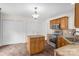 Bright kitchen with granite countertops, a center island, and stainless steel appliances at 208 N Kayla Dr, Salisbury, NC 28146